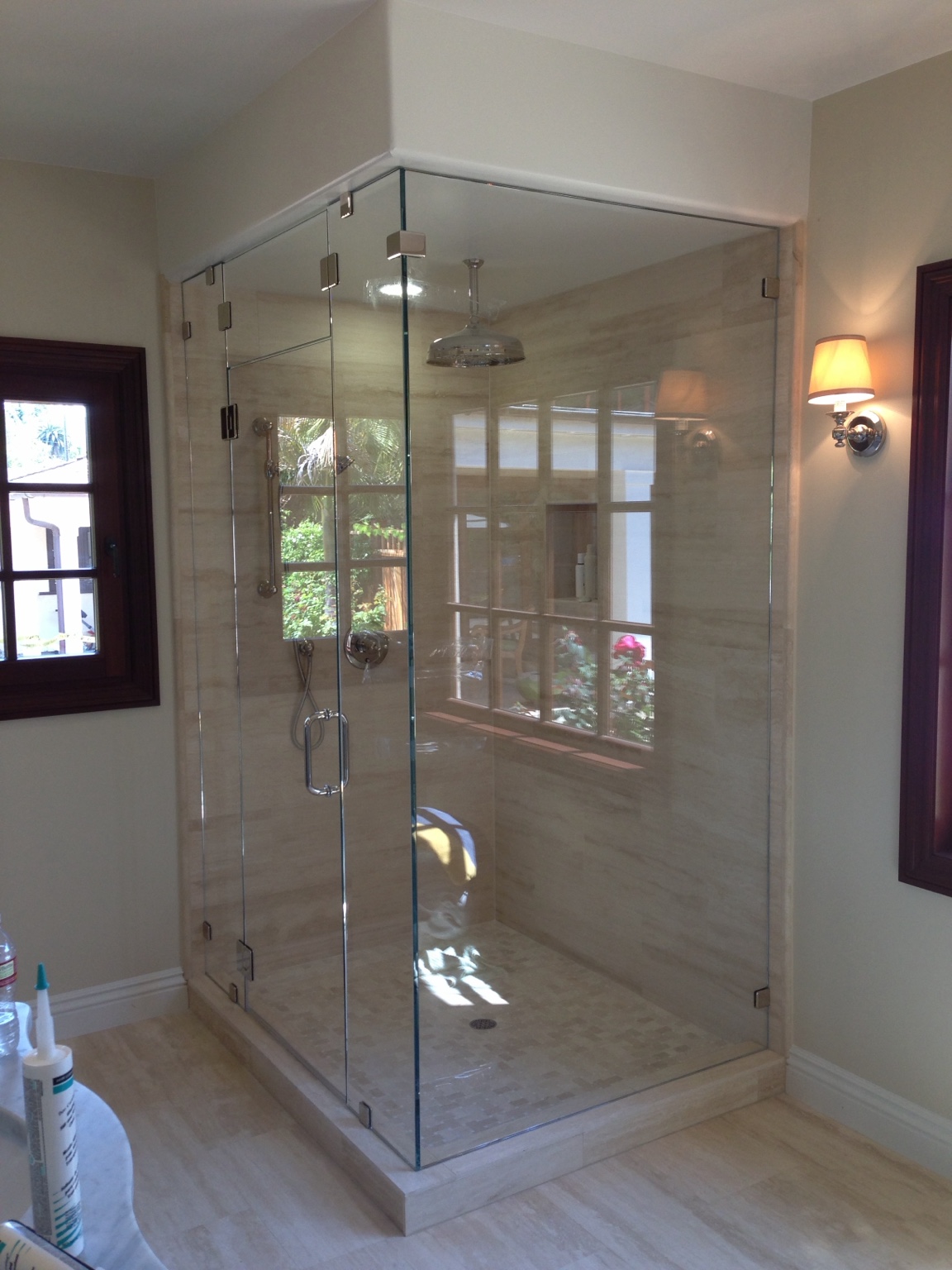 Frameless shower enclosure